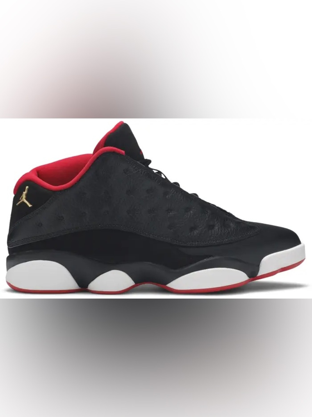 Air Jordan 13 Retro Low 'Bred' in Black with red accents and textured leather.